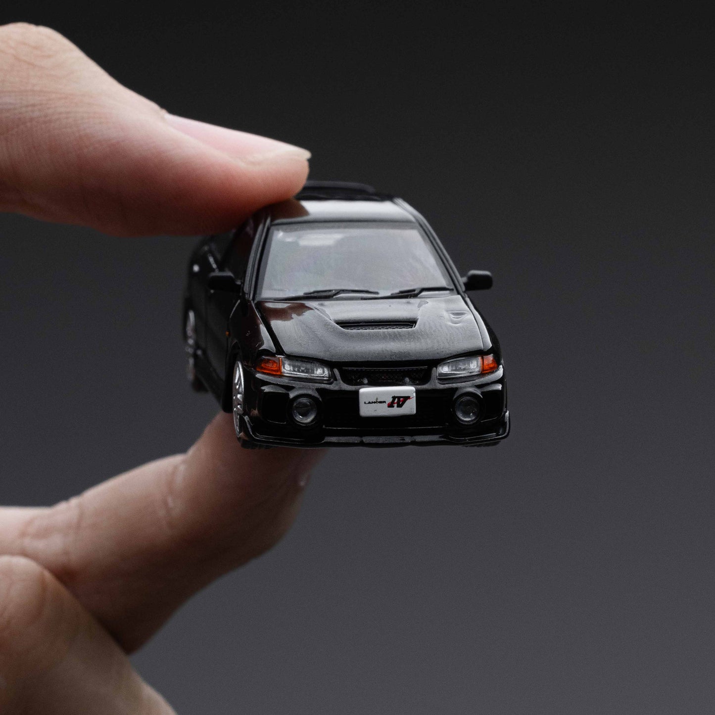 POPRACE 1:64 MITSUBISHI LANCER EVOLUTION IV – PYRENEES BLACK PEARL